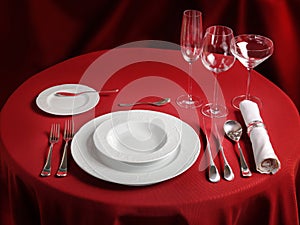 Professional setting of red dinner table