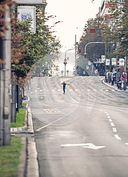 Professional skateboarder riding a skateboard slope on the capital city streets