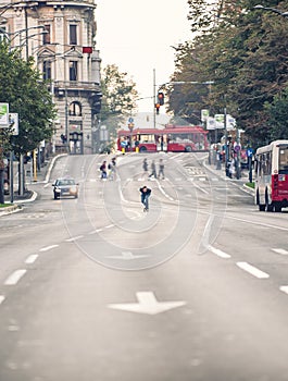 Professional skateboarder riding a skateboard slope on the capital city streets