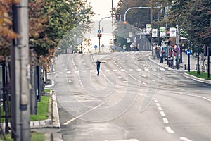 Professional skateboarder riding a skateboard slope on the capital city streets