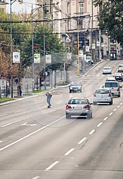 Professional skateboarder riding a skateboard slope on the capital city streets