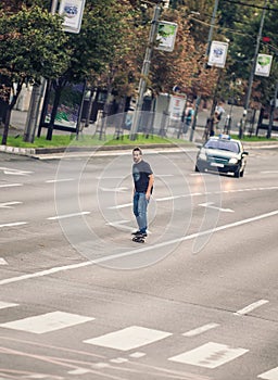 Professional skateboarder riding a skateboard slope on the capital city streets