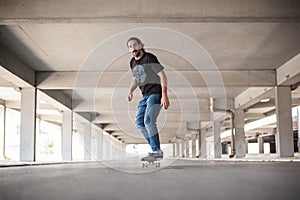 Professional skateboarder in underground passage