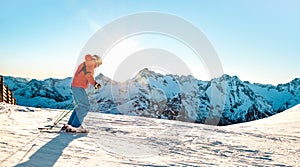 Professional skier athlete skiing at sunset on top of french alps - Winter vacation and sport concept with adventure guy on