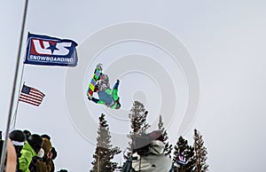 Snowboarder catches air at the half-pipe competition, Mammoth Mountain, California USA