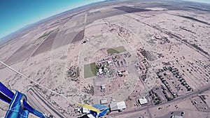 Professional skydiver fly on parachute above Arizona. Sunny day. Extreme.