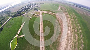 Professional skydiver fly in sky above green fields. Sunny. Landscape. Nature