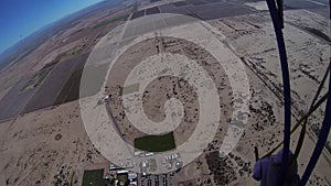 Professional skydiver parachuting above arizona. Landscape. Sunny day. Horizon