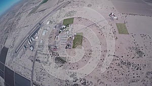 Professional skydiver parachuting in sky above Arizona. Sunny day. Landscape