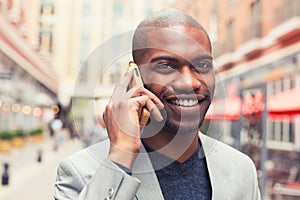 Professional smiling man using smart phone talking on mobile