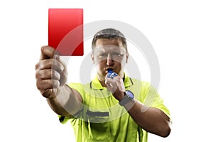 Professional soccer referee giving the red card isolated