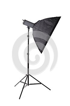 A professional softbox isolated on a white background. Professional photography. Black studio flash with a softbox.