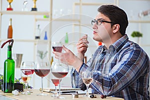 The professional sommelier tasting red wine