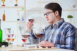 The professional sommelier tasting red wine