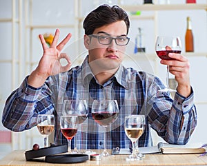 Professional sommelier tasting red wine