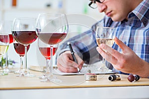 The professional sommelier tasting red wine