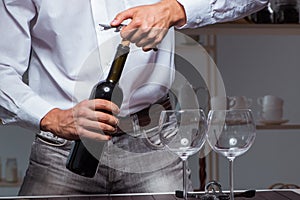 The professional sommelier tasting wine in restaurant