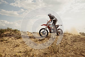 Professional speed rider driving in motocross race