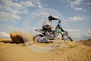 Professional speed rider driving in motocross race