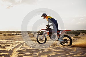 Professional speed rider driving in motocross race