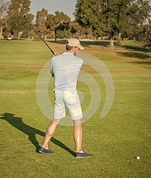 professional sport outdoor. back view. male golf player on professional golf course.