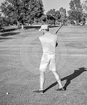 professional sport outdoor. back view. male golf player on professional golf course.