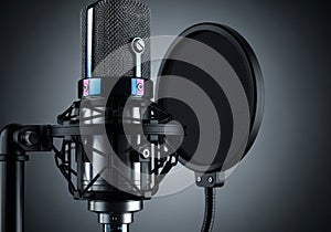 Professional studio condenser microphone with pop filter on a stand