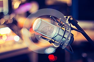 Professional studio microphone, recording studio, equipment in the blurry background