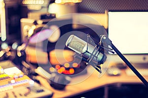 Professional studio microphone, recording studio, equipment in the blurry background