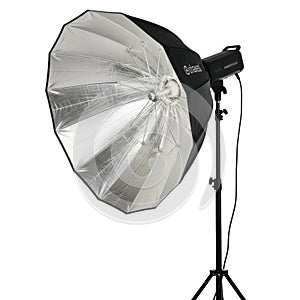 Professional photography studio strobe light with large octagonal softbox on a stand isolated on white background