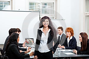 Professional successful business woman in office smiling