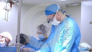 A professional surgeon performs heart surgery on a patient
