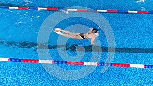 Professional swimmer in swimming pool. Slow motion.