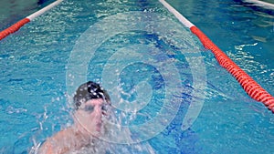Professional swimmer during training close-up