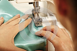 Professional tailor, fashion designer sitting and working at sewing studio. Needlework, tailoring,fashion, clothing repair and dre