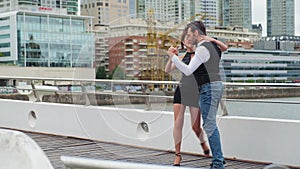 Professional tango dancers dancing on a bridge over Puerto Madero docks