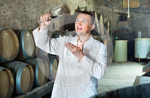 Professional taster posing with glass of wine