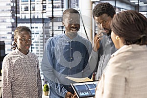 Professional team analyzing archived data on a modern device