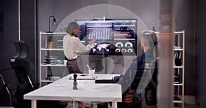 Professional Team in a Conference Room with TV Screen and Board