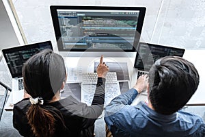 Professional Team of programmer working on project in software development computer in IT company office, Writing codes and data