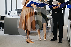 Professional teamwork and collaboration at office, colleagues with documents and reports