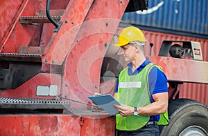 Professional technician pre-check forklift truck at container cargo, Factory worker man in hard hat, safety concept