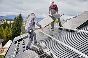 Professional technicians carrying solar PV battery