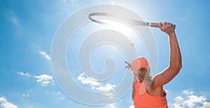 Professional tennis woman player in an action playing tennis in tennis court outdoor, sport concept, copyspace