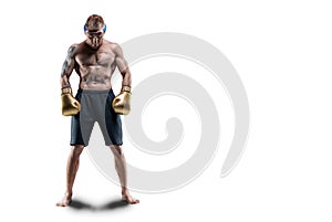 Professional Thai boxer stands in full combat gear. Muay Thai, kickboxing, martial arts concept