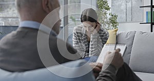 Professional therapist listening to a patient