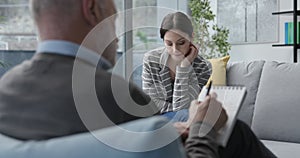 Professional therapist listening to a patient