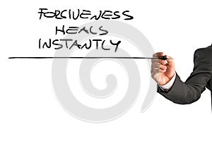 Professional therapist writing a Forgiveness heals instantly say