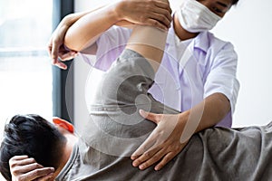 Professional therapists are stretching muscles, patients with abnormal muscular symptoms