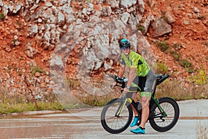 A professional triathlete preparing for a training ride on a bicycle